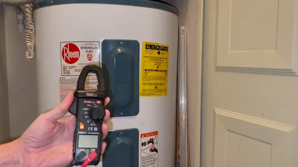 Clamp meter held beside a water heater